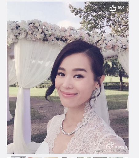 胡杏儿晒大婚现场照 与老公热吻秀对戒(组图)