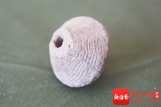 陵水桥山遗址发掘出土的纺轮.